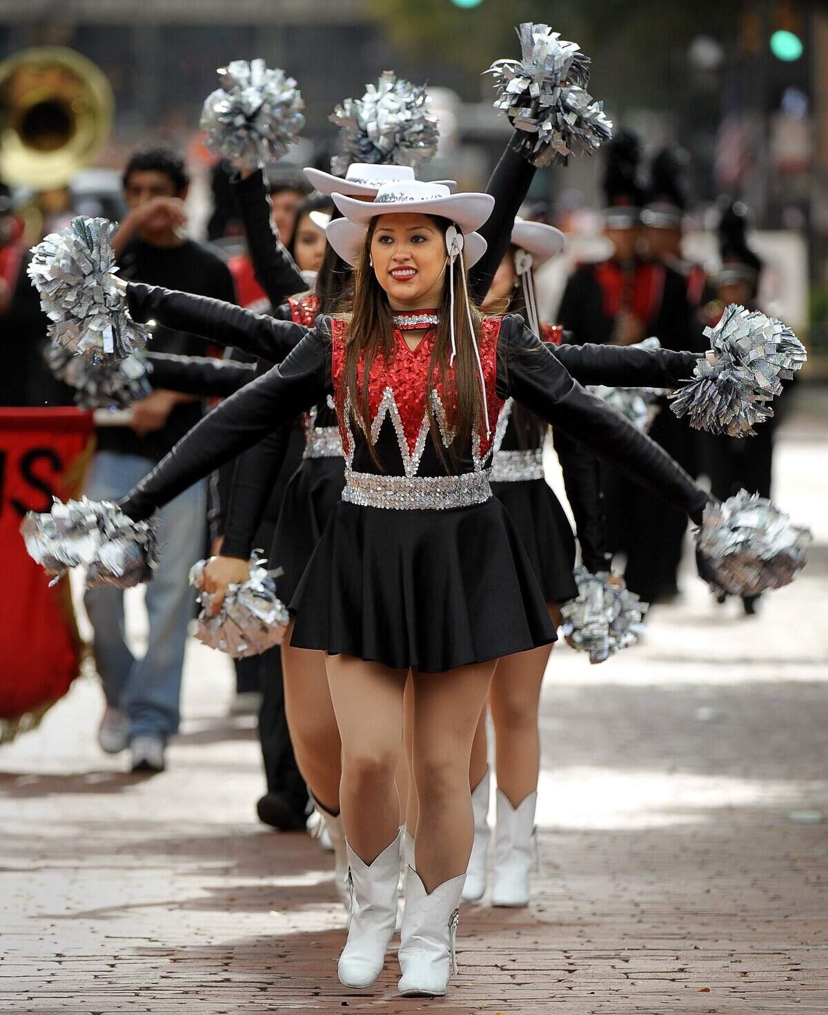 Nov. 11, 2010: Members of the Dazzler Drill team from Diamond Hill-Jarvis High School in the Fort Worth Veterans Day parade on Main Street.