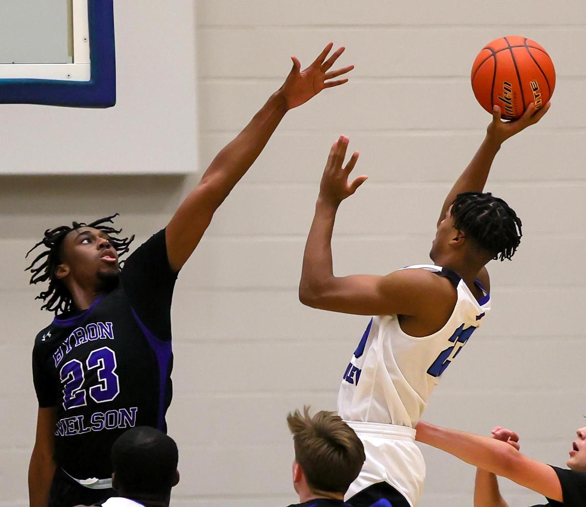 North Crowley forward KD Davis (R) shoots over Byron Nelson forward Jesse Iweze (23) during the second half, Friday, February 26, 2021 of a 6A Region 1 Quarterfinal High School playoff Basketball game played at the Thomas Coliseum in Haltom City, Tx. (Steve Nurenberg Special to the Star-Telegram)