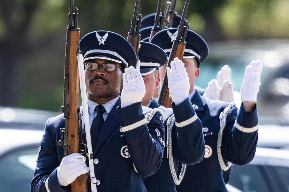 U.S. Air Force Honor Guard members line up for the 21-gun salute during the military ceremony for Ava Moore following her funeral at the Met Church on Saturday, May 31.