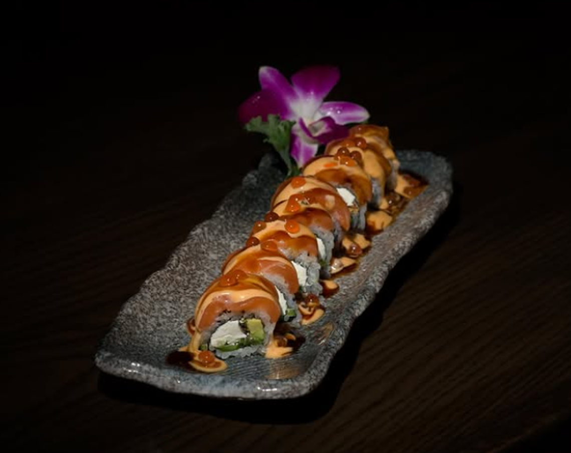 The Philadelphia roll is topped with smoked salmon, filled with cream cheese, avocado and mango.