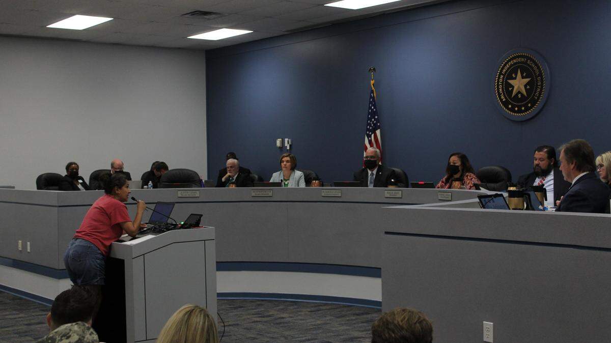An audience member urges Arlington school board members to comply with Gov. Greg Abbott’s executive order barring schools from issuing mask mandates Thursday. The board voted 5-2 against imposing a mandate and tabled discussion of suing Abbott.