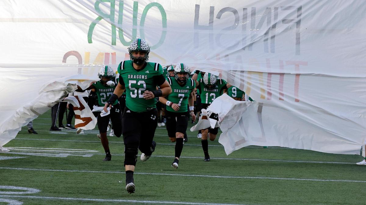 The Southlake Carroll Dragons take the field for the first half of a UIL Conference 6A Division 2 regional-round football playoff game at Choctaw Stadium in Arlington, Texas, Friday, Nov. 24, 2023.