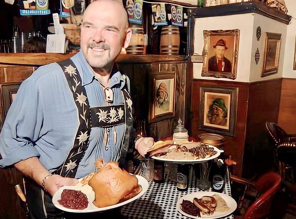 Bernd Schnerzinger holds plates of food at Edelweiss in 2007. 
