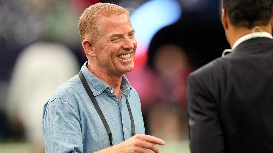 Former Dallas Cowboys coach Jason Garrett, left, talks with Tony Gonzalez an NFL preseason football game Thursday, Aug. 25, 2022, in Houston.