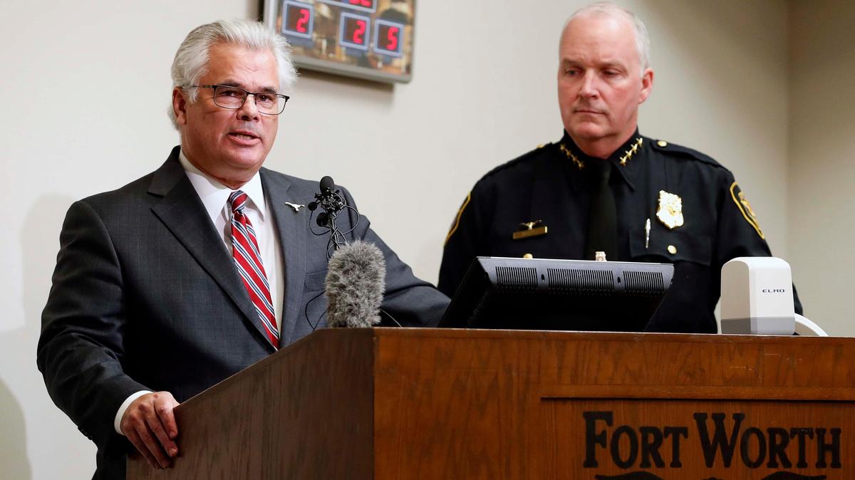 Fort Worth city manager David Cooke standing next to former interim police chief and current head of Sundance Square security Ed Kraus. Cooke came under scrutiny for personal travel with Sundance Square co-owners Ed and Sasha Bass.