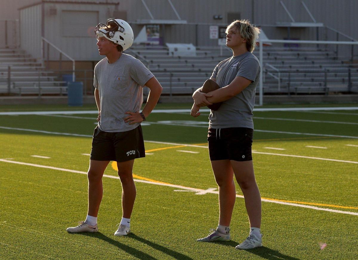 Southlake Carroll kicker Kyle Lemmermann, right, and TCU kicker Griffin Kell watch as kicks sail through the goal post during a summer workout on Monday, July 24, 2023, at Paschal High School in Fort Worth. Lemmermann is a TCU commit and Chris Sailer’s No. 1 ranked kicker in the nation.