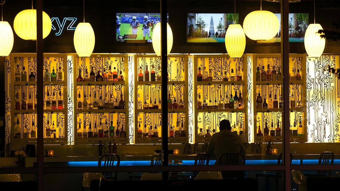 A patron drinks at WXYZ Bar in Aloft Fort Worth Downtown on Tuesday, Aug. 6.