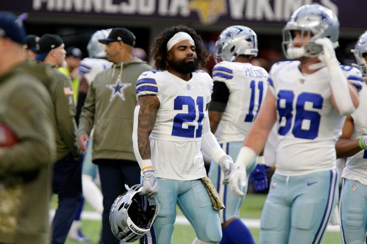 Dallas Cowboys running back Ezekiel Elliott (21) warms up before an NFL football game against the Minnesota Vikings, Sunday, Nov. 20, 2022, in Minneapolis. (AP Photo/Andy Clayton-King)