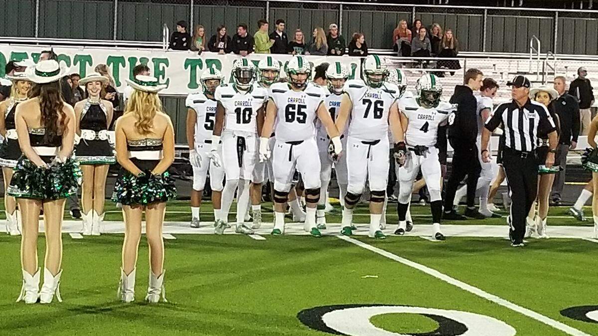 Southlake Carroll captains line up to participate in the coin toss before their game with Keller Central at the Keller ISD Athletic Complex. Thursday, Oct. 25, 2018.