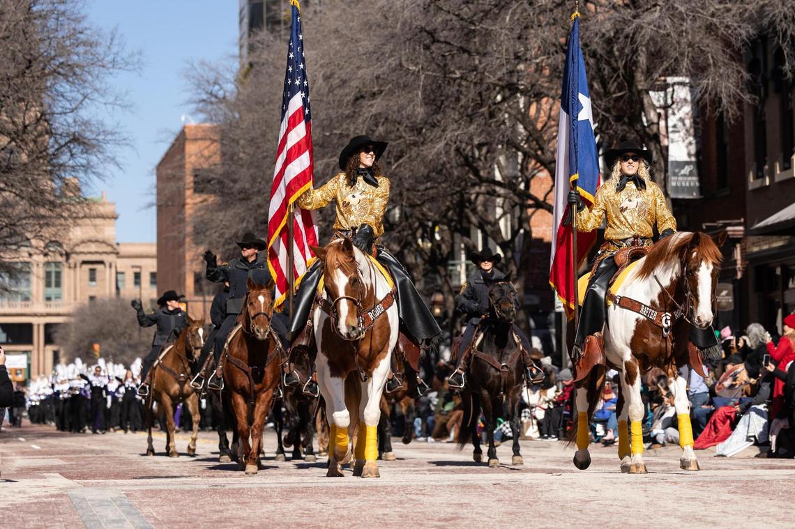 Megan Gay Maier, left, and Summer Gay of Rafter G Rodeo Company lead the Fort Worth Stock Show All Western Parade down Main Street in downtown Fort Worth on Saturday, Jan. 18, 2025.