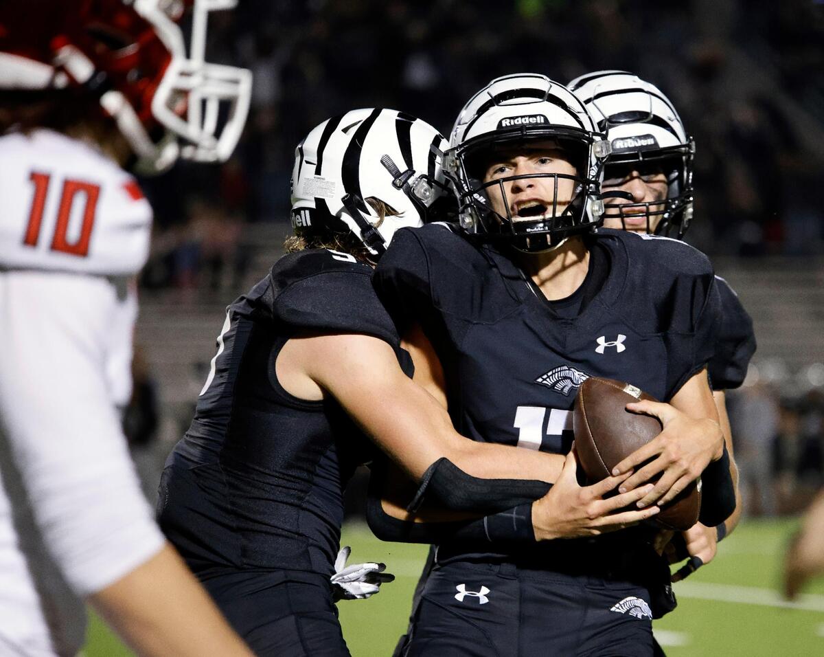 Teammates celebrate after Grandview safety Easton Ebner (17) intercepted a pass intended for Pottsboro wide receiver Carson Butscher (10) the second half of a UIL Class 3A Division 1 area round playoff football game at Mesquite Memorial Stadium in Mesquite, Texas, Thursday, Nov. 16, 2023.