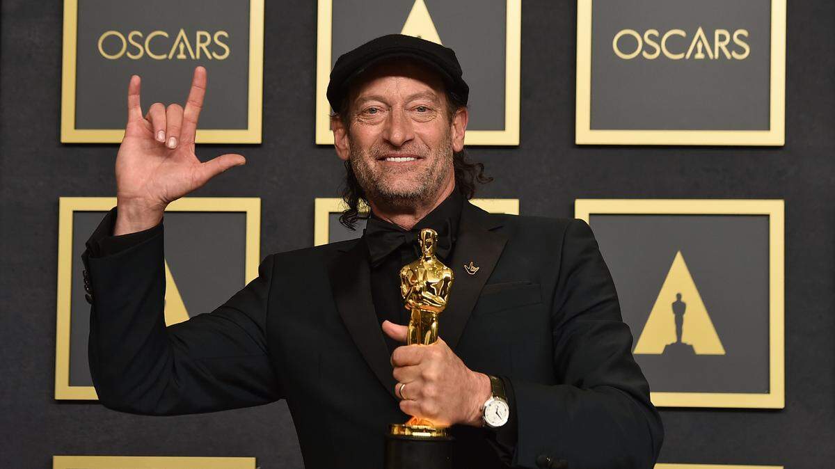 Troy Kotsur, winner of the award for best performance by an actor in a supporting role for “CODA,” poses in the press room at the Oscars on Sunday, March 27, 2022, at the Dolby Theatre in Los Angeles.