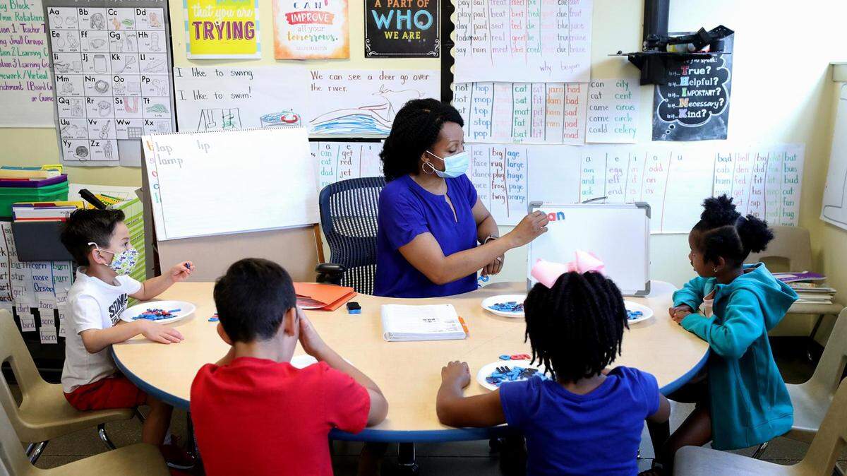 Tequila Lockridge, a leveled literacy interventionist at UCC Polytechnic Center, leads a small group of students through a Leveled Literacy Intervention session during the summer learning program on July 13, 2021, in Fort Worth.