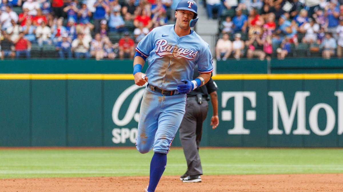 Texas Rangers designated hitter Corey Seager (5) hits a home run during the second inning against the Colorado Rockies at Globe Life Field. Seager’s return has helped the Rangers rise in national experts power rankings.