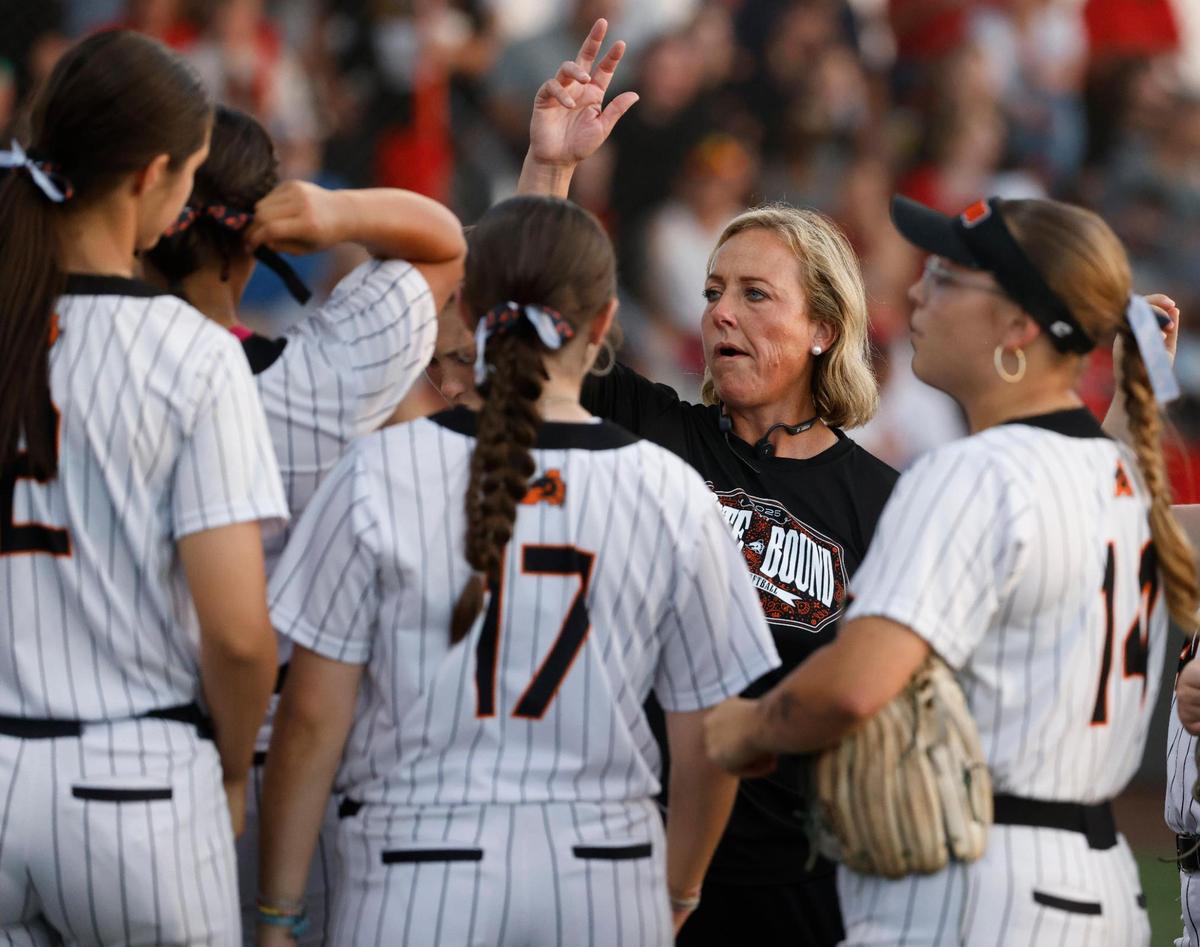 Aledo head coach Heather Myers talks to the team during an inning change during the UIL softball state semifinals 5A D1 playoff game at Trojan Softball Field in Euless, Texas, Wednesday, May 21, 2025.