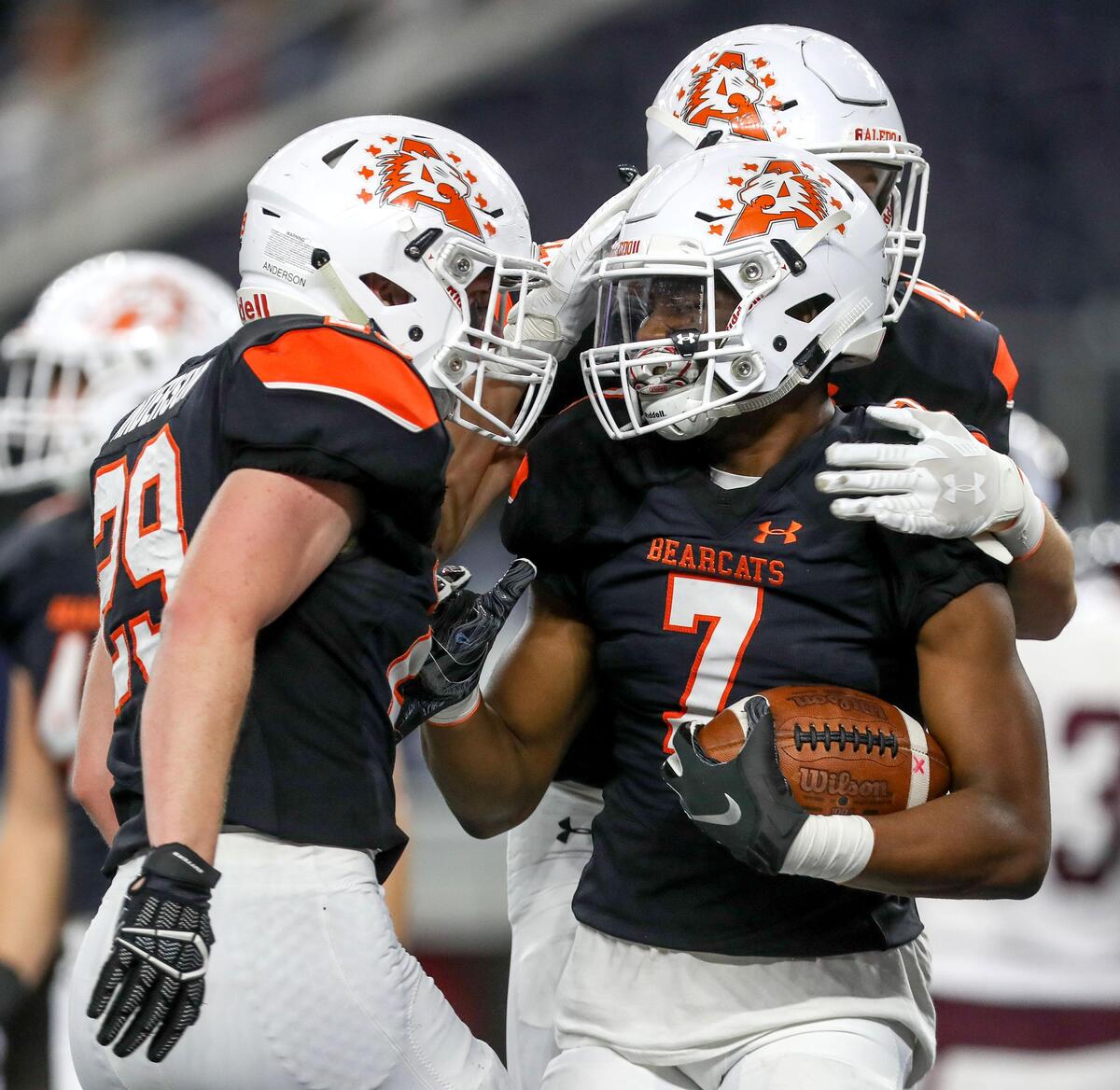 Aledo’s Bryan Allen (7) celebrates with a 10 yard fumble return for a touchdown against Red Oak during the first half of their 5A Division II Regional Round High School Football playoff game at AT&T Stadium in Arlington, Tx Friday November 29, 2019.