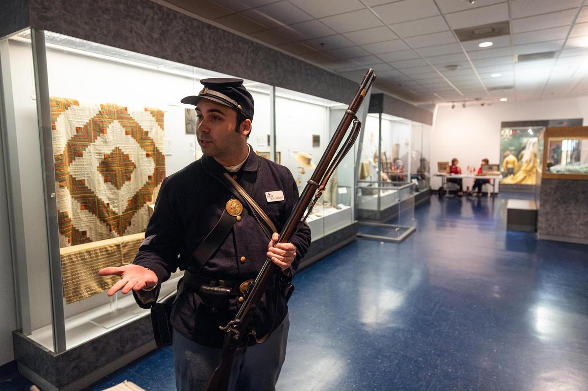Collin Jefferson, a docent at the Texas Civil War Museum, explains an exhibit on the museum’s final day.