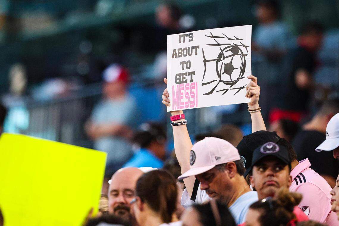 A fan holds up a sign saying “Its about to get Messi” prior to a a Leagues Cup match between FC Dallas and Inter Miami CF at TOYOTA Stadium in Frisco, Texas on Sunday, Aug. 6, 2023.