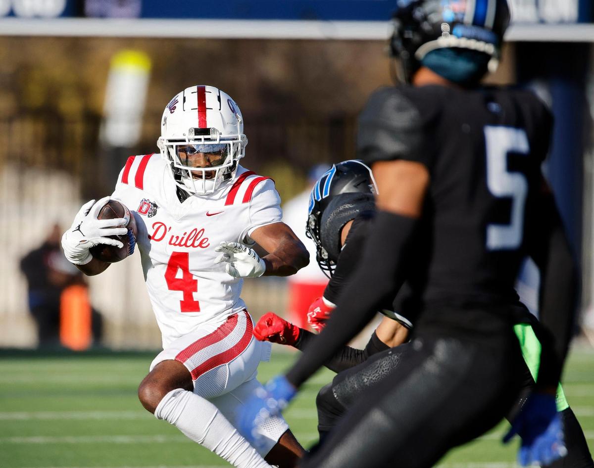 Duncanville wide receiver Ayson Theus (4) cuts to the outside during the first half of a UIL Conference 6A Division I state semifinal football playoff game at Mesquite Memorial Stadium in Mesquite, Texas, Saturday, Dec. 09, 2023. Duncanville led North Crowley 24-0 at the half.