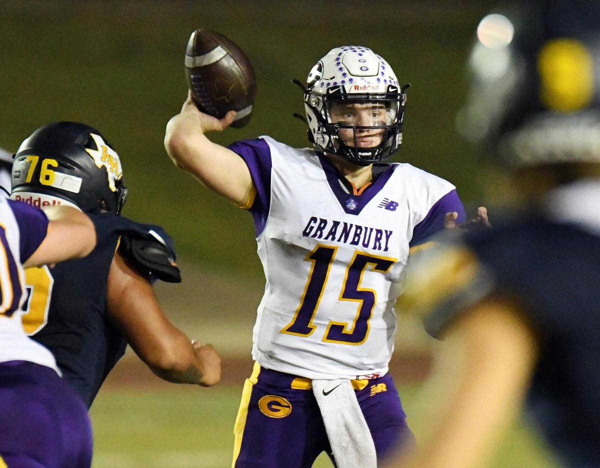 Grranbury quarterback Austin Jinkerson, center throws for a first down against Arlington Heights during the fourth quarter of their Division 1 District 3-5A football game Thursday, November19, 2020 at Farrington Field in Fort Worth, Texas. Granbury won 38-14. Special/Bob Haynes