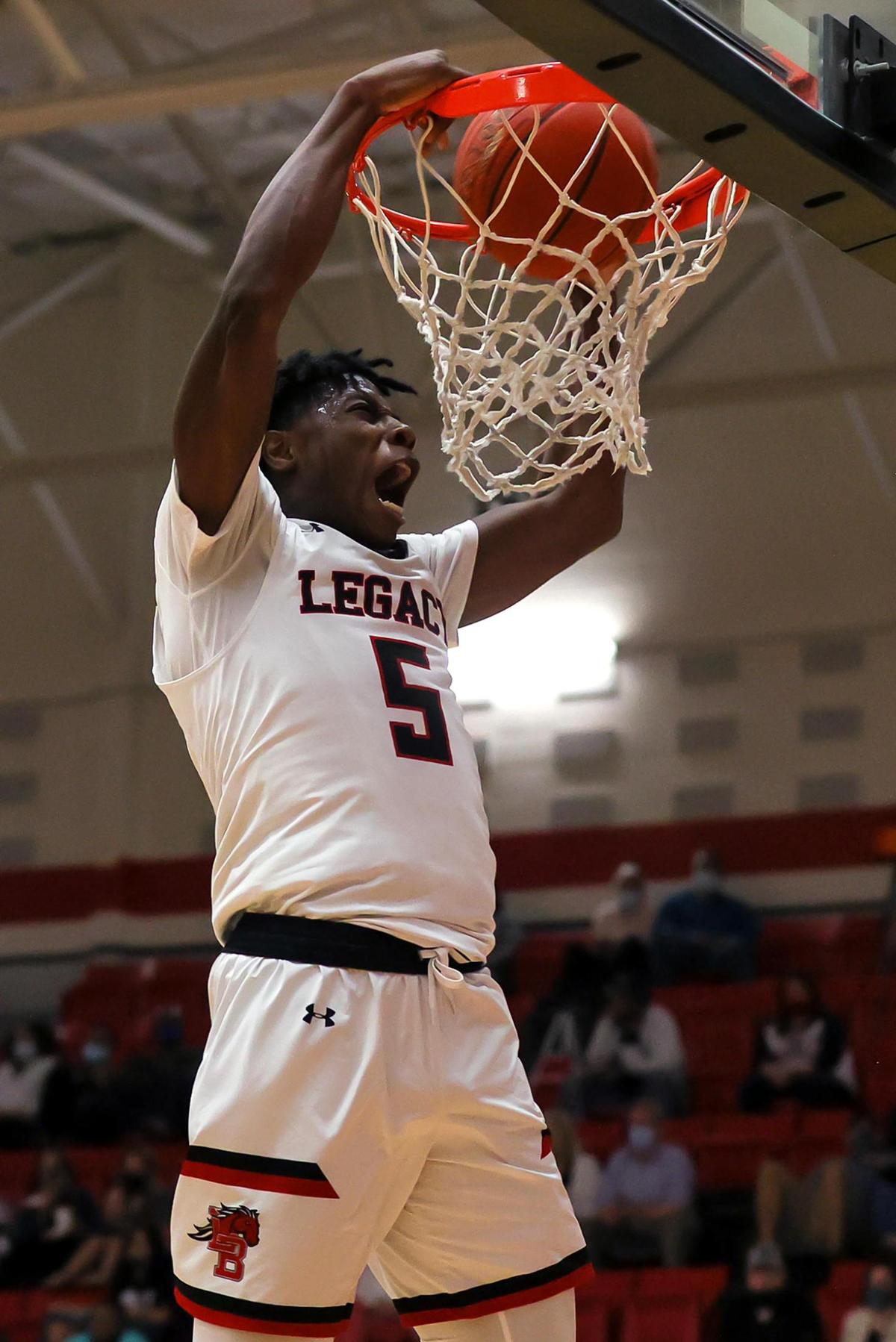 Mansfield Legacy guard Quion Williams slams home two points against Richland during the second half of a 5A Region 1 Boys Basketball Area-Round 2 playoff game played on February 24, 2021 at Burleson High School. (Steve Nurenberg Special to the Star-Telegram)