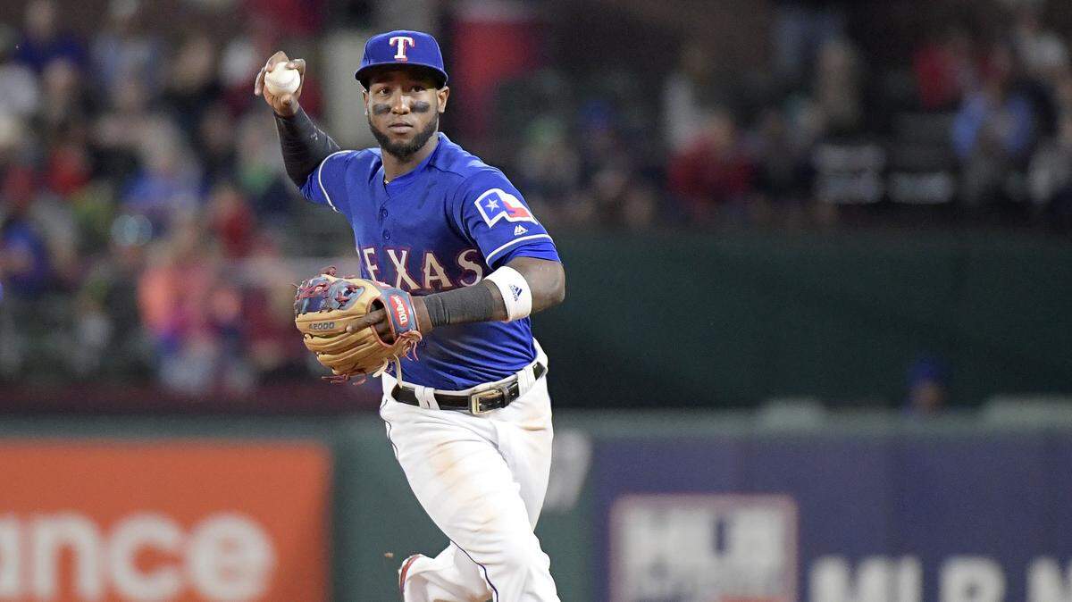 Texas Rangers shortstop Jurickson Profar (19) gets Seattle Mariners third baseman Kyle Seager (15) out at first base during the eighth inning as Seattle beats Texas 6 - 2 at Globe Life Park in Arlington, TX, Friday, April 20, 2018.