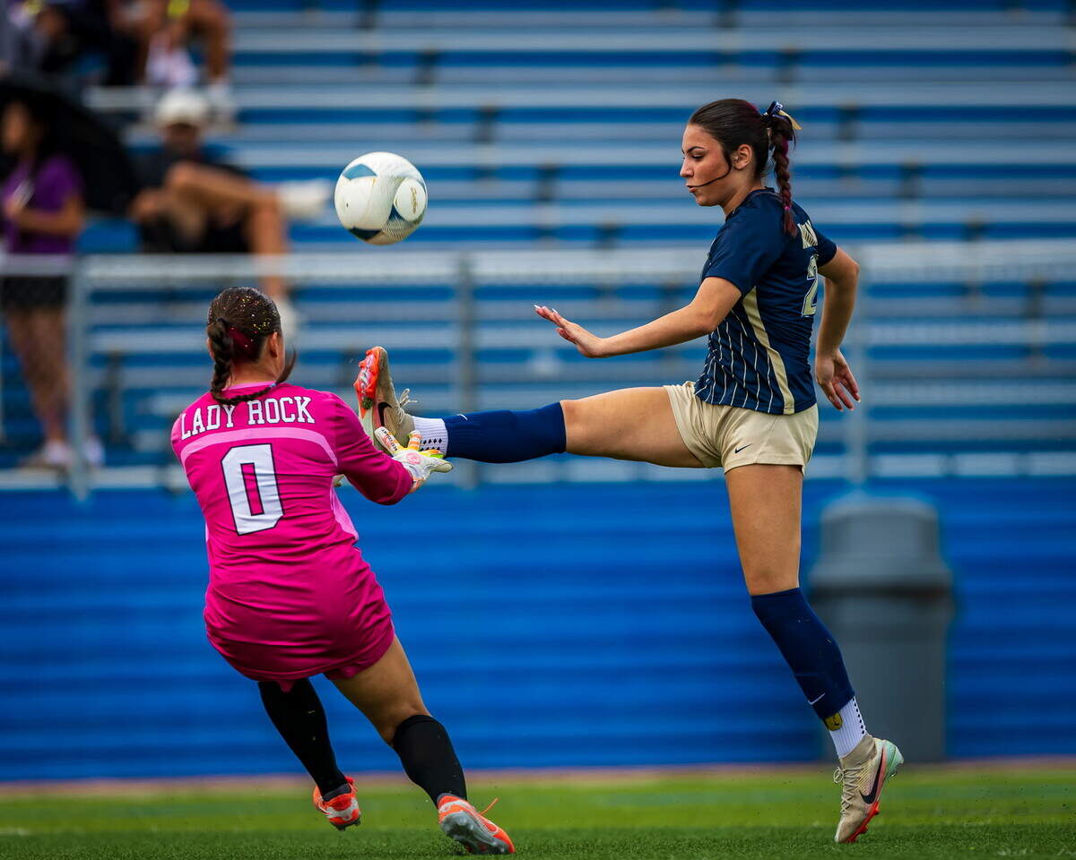 Round Rock goalkeeper Lucy Grazecki rushes the ball in the Class 6A Division I state championship game Saturday at Birkelbach Field in Georgetown.