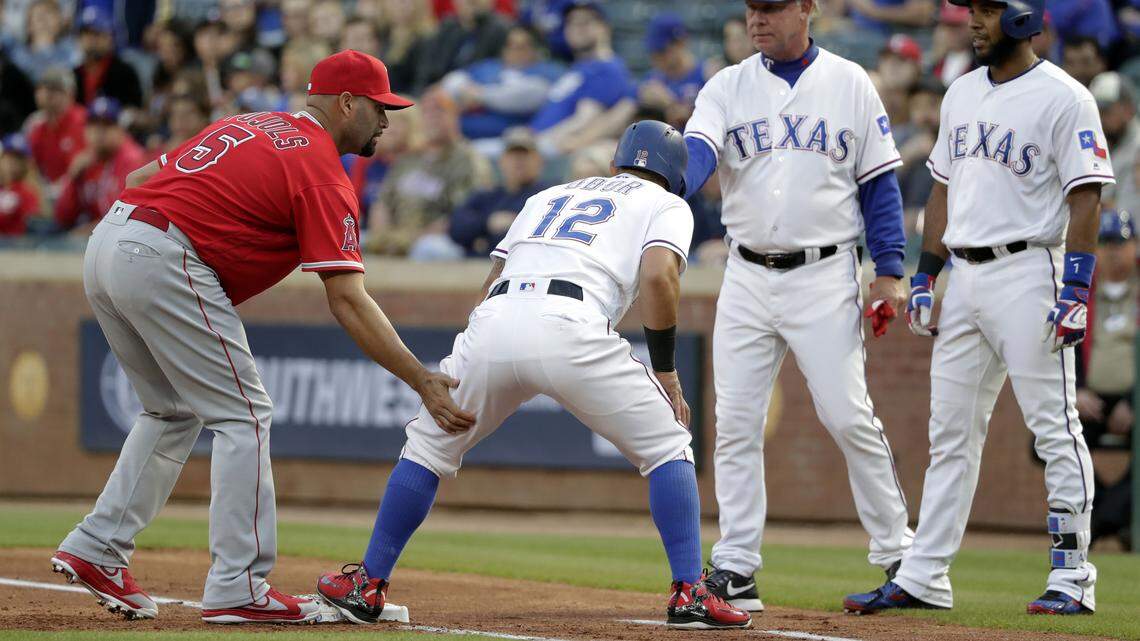 Albert Pujols tried to help Rougned Odor through a strained left hamstring that forced him to leave the game in the first inning and might force him to the disabled list.