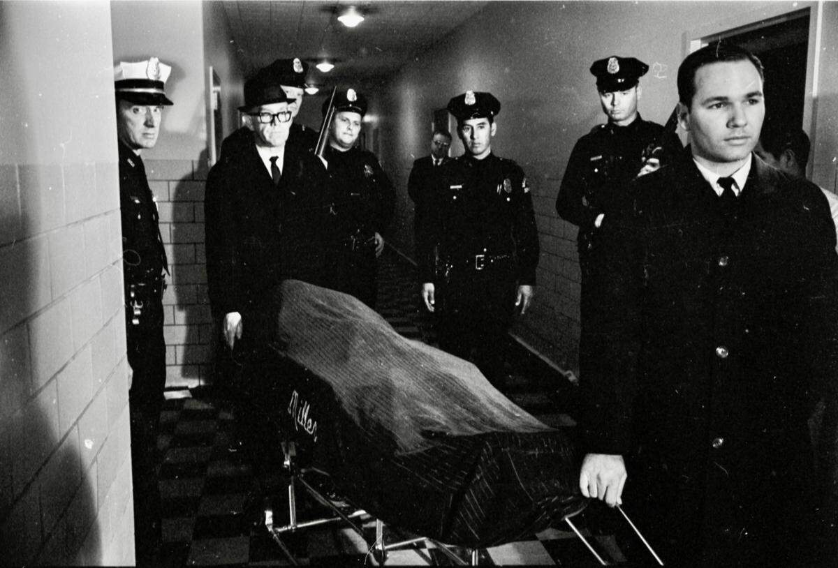 Miller Funeral Home funeral directors from Fort Worth remove the body of Lee Harvey Oswald from Parkland Hospital in Dallas Nov. 25, 1963.