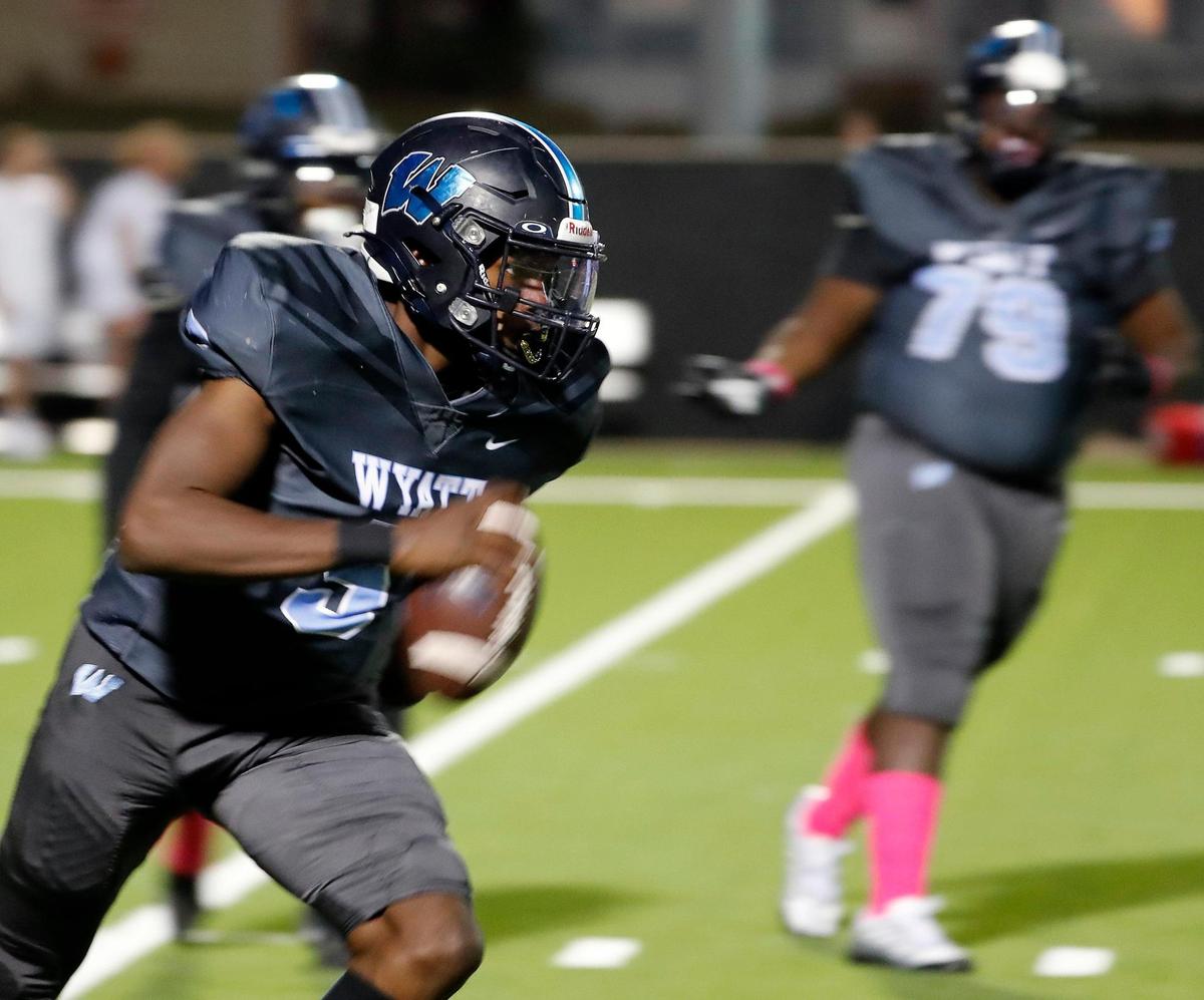 O.D. Wyatt quarterback Kaid Barrett (5) scrambles out of the pocket in the first half of a District 4-5A Division 2 football game at Scarborough-Handley Field in Fort Worth, Texas, Thursday, Oct. 20, 2022. Grapevine led Wyatt 35-7 at the half. (Special to the Star-Telegram Bob Booth)