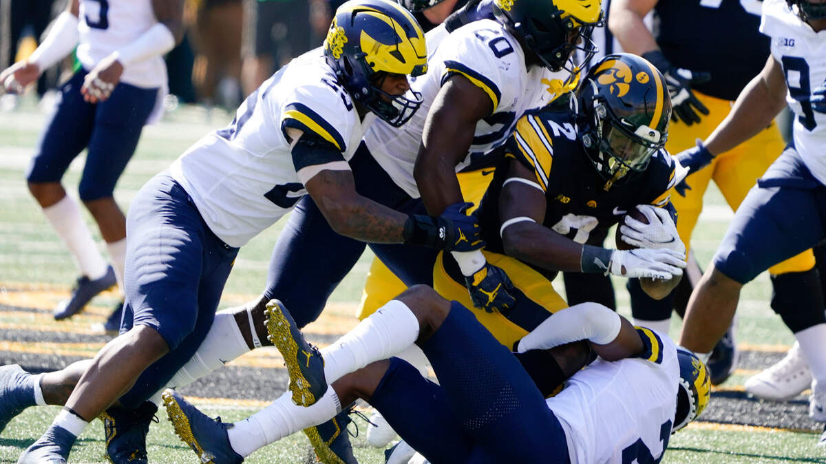 Michigan linebacker Junior Colson, left, Kalel Mullings and defensive back Will Johnson, right, figure to cause the TCU offense fits on Saturday in the Vrbo Fiesta Bowl.