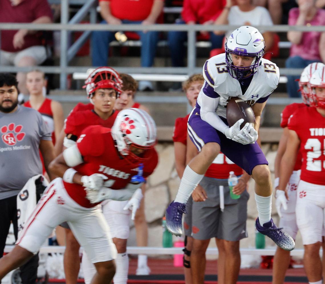 Alvarado wide receiver Logan Bjork (13) grabs a pass in front of Glen Rose defensive back Adrian Sanchez (1) during a UIL football game at Tiger Stadium in Glen Rose Texas, Friday, Sept. 27, 2024.
