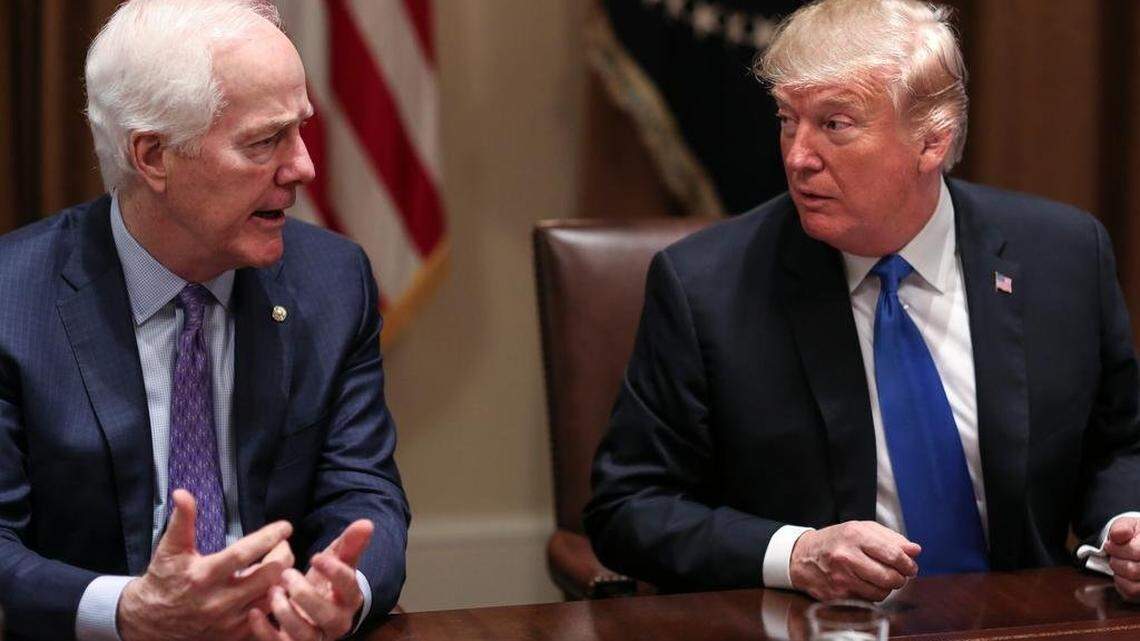 President Donald Trump, right, listens as Senator John Cornyn (R-Texas) speaks during a meeting with bipartisan members of Congress on school and community safety in the Cabinet Room of the White House on Wednesday, Feb. 28, 2018, in Washington, D.C.