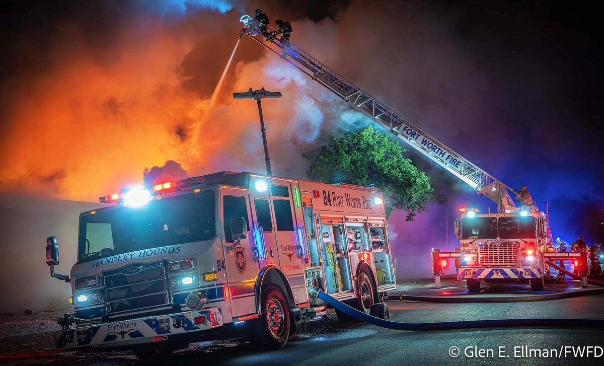 Around 100 firefighters helped battle a blaze early Thursday in the 5900 block of Tension Drive in east Fort Worth. One of the firefighters was taken to the hospital after a wall collapsed on him.
