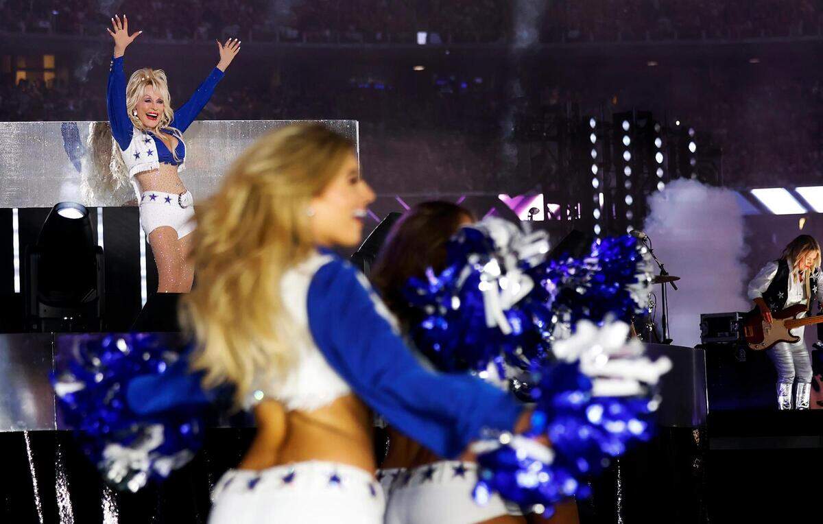 Dolly Parton performs during the Dallas Cowboys’ halftime show to kickoff the Red Kettle Campaign on Thursday, November 23, 2023, at AT&T Stadium in Arlington.