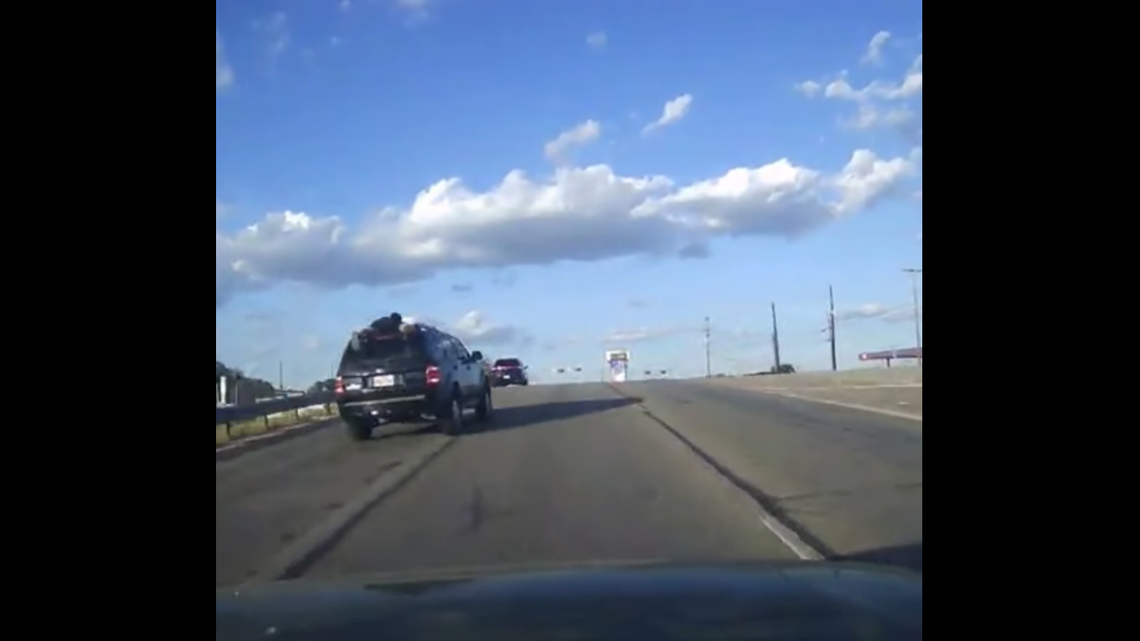 A man in Live Oak, Texas, jumped on to the roof of his SUV in an attempt to stop it from being stolen, according to police. He was still clinging to the vehicle throughout a high speed police chase.