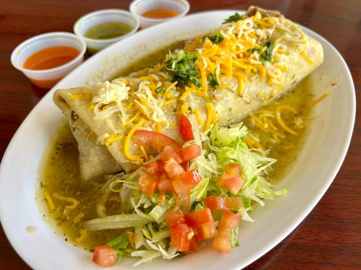 A “wet” carnitas burrito at Vaqueros in Watauga.
