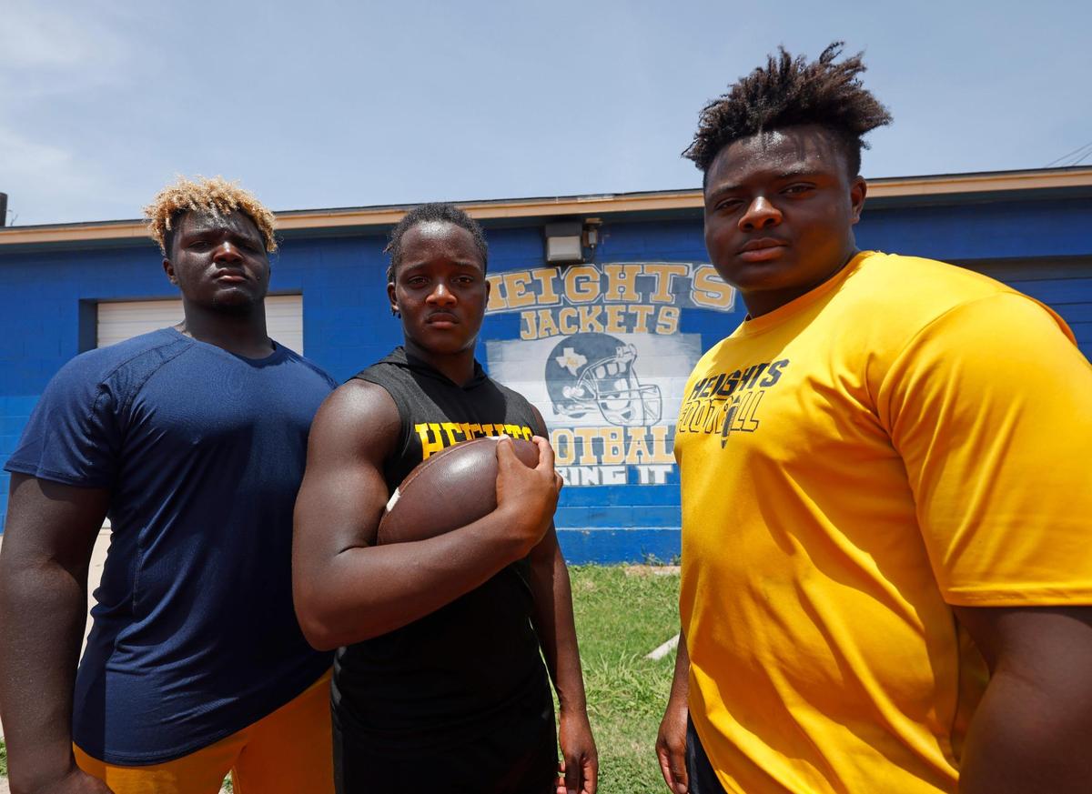 Arlington Heights head football coach Curtis James’ sons who play on the team: defensive end Caynan, running back Carson and defensive end Carter.
