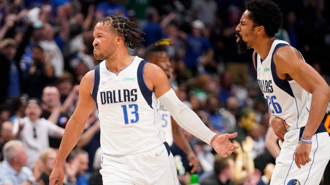 Dallas Mavericks guard Jalen Brunson, left, and Spencer Dinwiddie celebrate Brunson’s 3-pointer in the first half of Game 2 Monday in Dallas. Brunson scored a career-high 41 points in the Mavericks’ 110-104 victory to tie the series at 1-1.