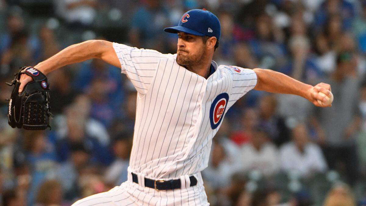Cole Hamels tossed a complete game Thursday night for the Chicago Cubs and has a 0.79 ERA after his first five starts since the Texas Rangers traded him last month.