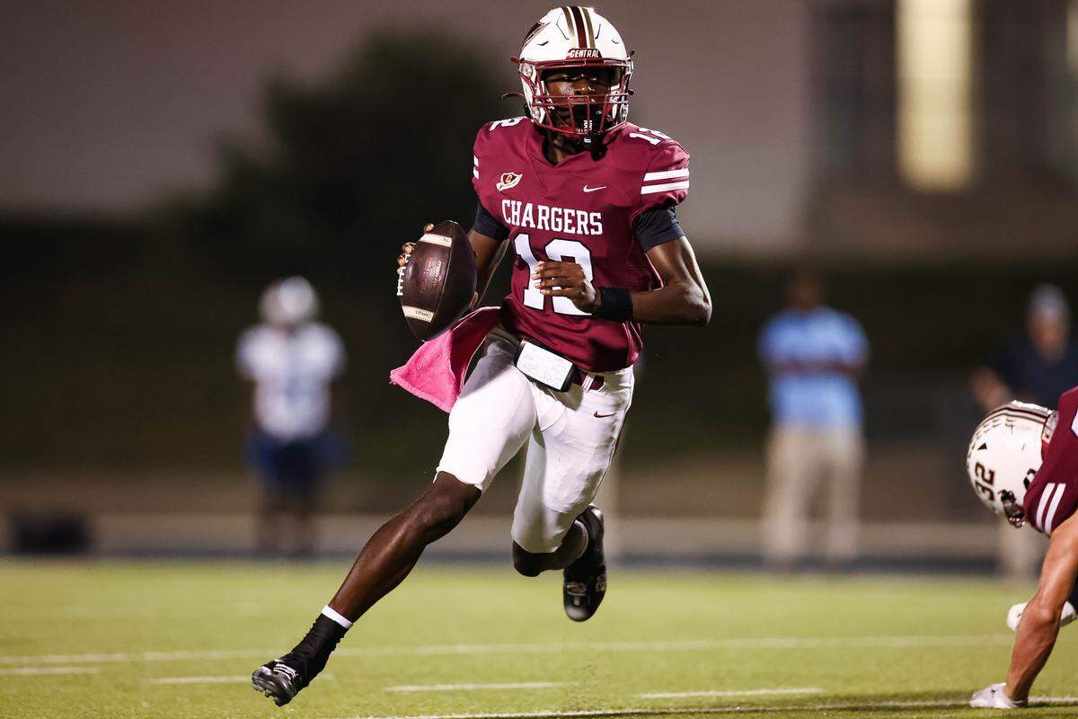 Keller Central quarterback Isaiah Taylor runs with the football looking downfield for his teammates during a district game between Keller Central and L.D. Bell at Keller ISD Stadium in Keller, Texas on October 16, 2025.