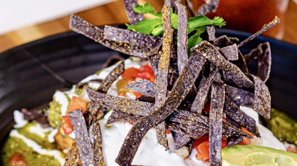 Blue corn chilaquiiles are a Texas favorite on the menu at Urban Egg.