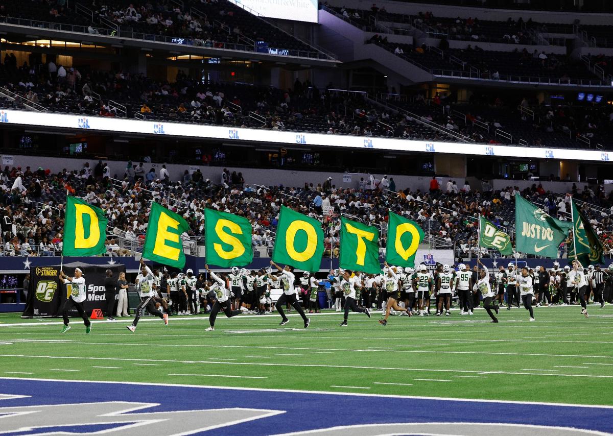 The DeSoto flag runners celebrate a touchdown during the second half of the UIL Conference 6A Division 2 state championship football game at AT&T Stadium in Arlington, Texas, Saturday, Dec. 16, 2023.