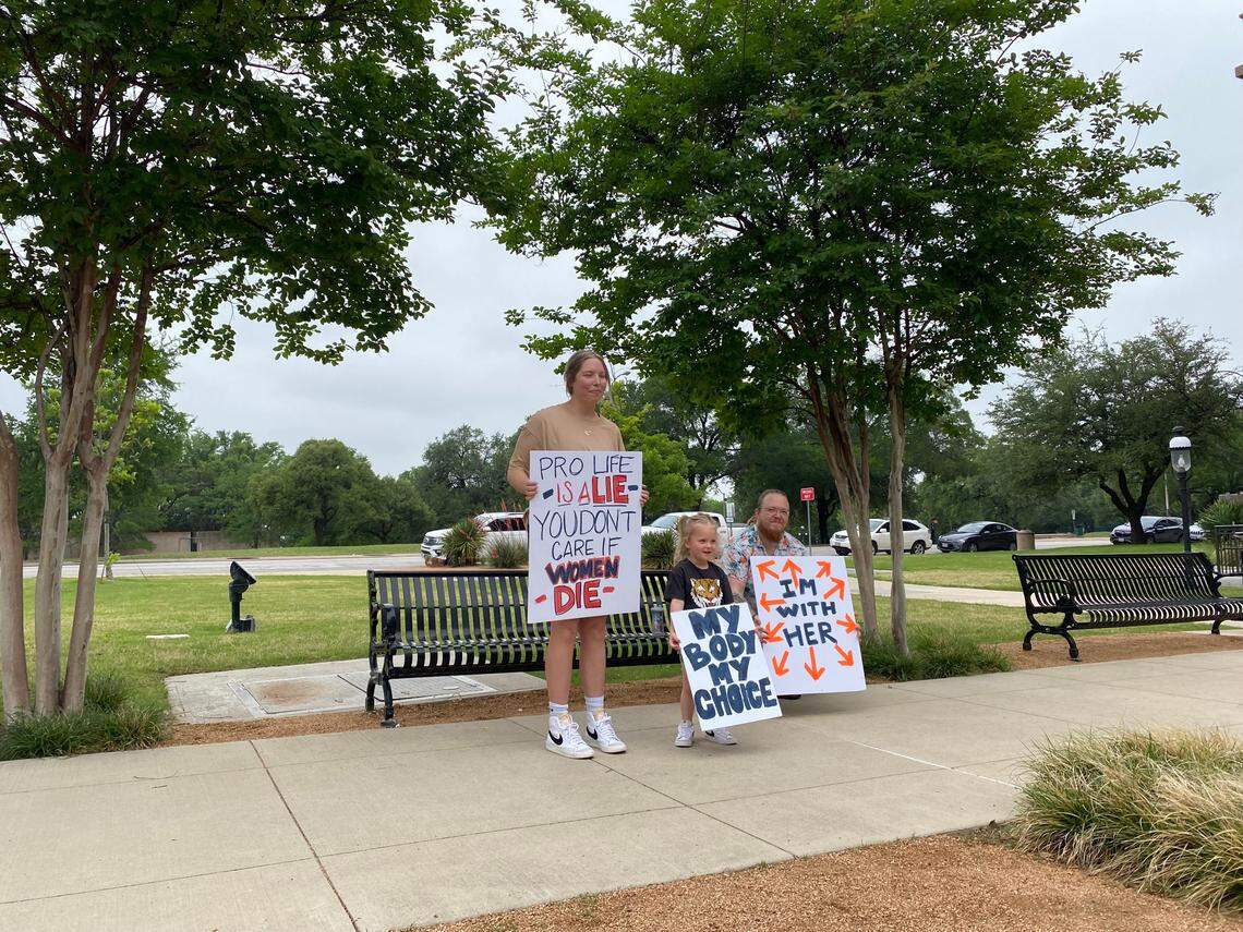 Protestor Holly Fulleright with her daughter and partner.