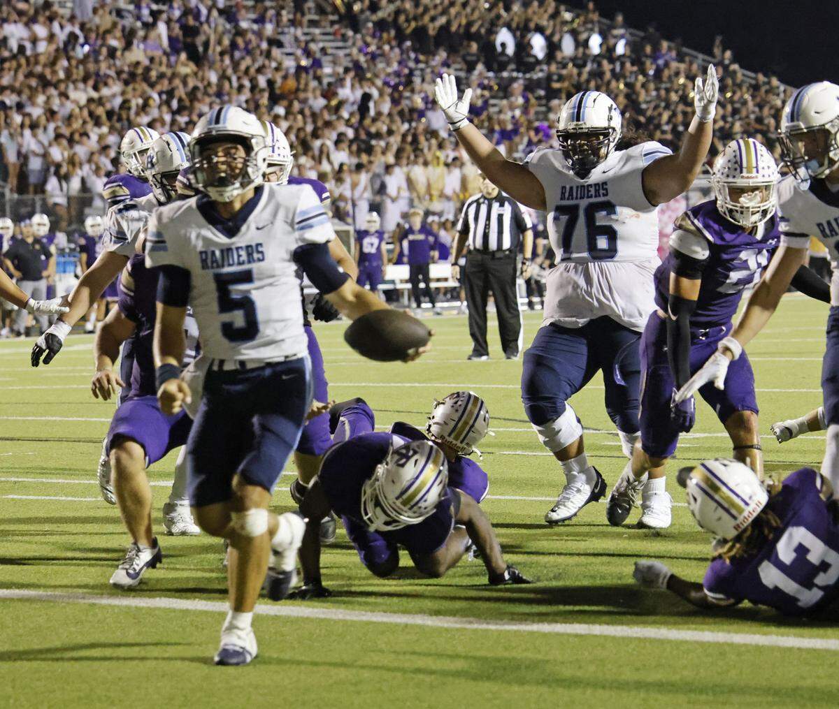 L.D. Bell quarterback Braylon Harris (5) scores the winning touchdown during the second half of a UIL football game between L.D. Bell and Timber Creek at Keller ISD Athletic Complex in Keller on Thursday, Sept. 11, 2025.