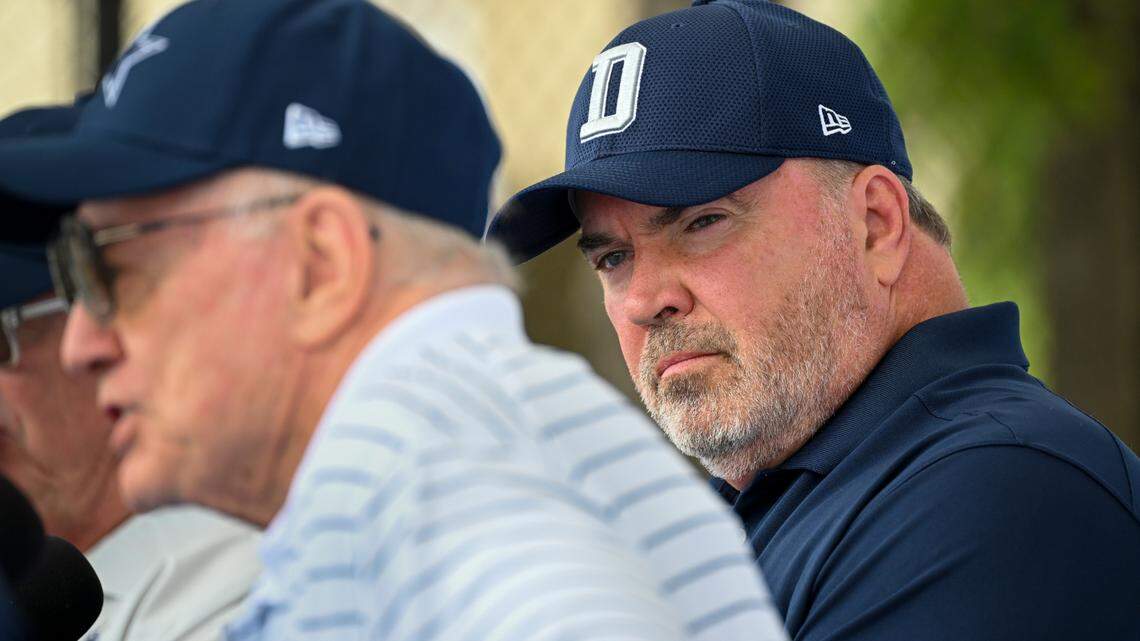 Dallas Cowboys head coach Mike McCarthy, right, looks on as owner Jerry Jones takes questions from the media at the start of NFL football training camp, July 2022, in Oxnard, Calif. The duo will be there again in six months.