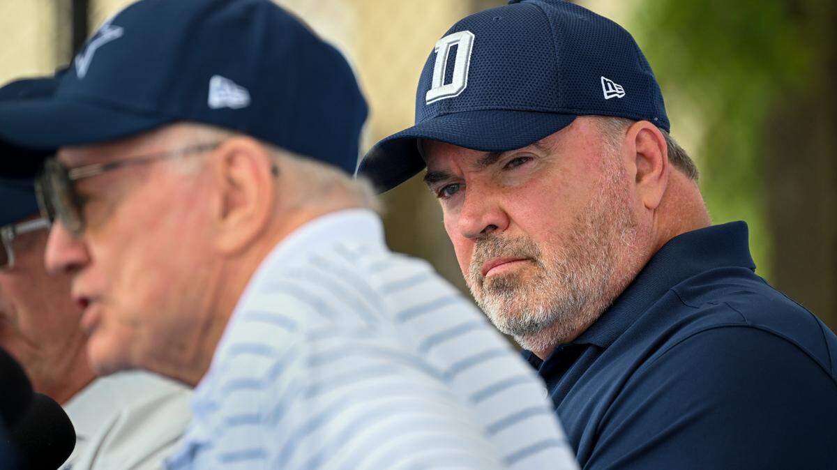 Dallas Cowboys head coach Mike McCarthy, right, looks on as owner Jerry Jones takes questions from the media at the start of NFL football training camp, Tuesday, July 26, 2022, in Oxnard, Calif. 