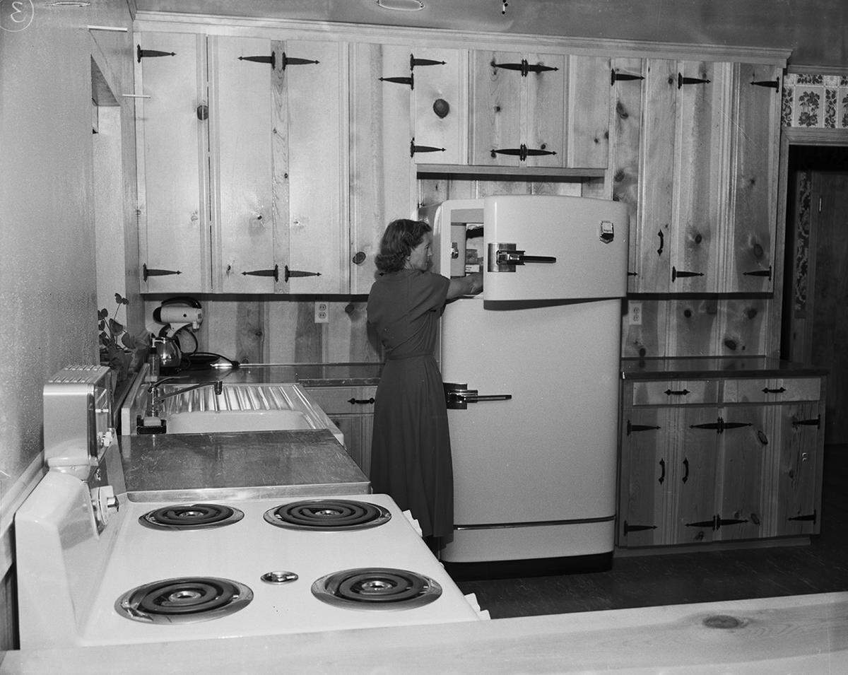 Sept. 20, 1950: Mrs. Brown is shown in the kitchen, which is equipped with all modern appliances.