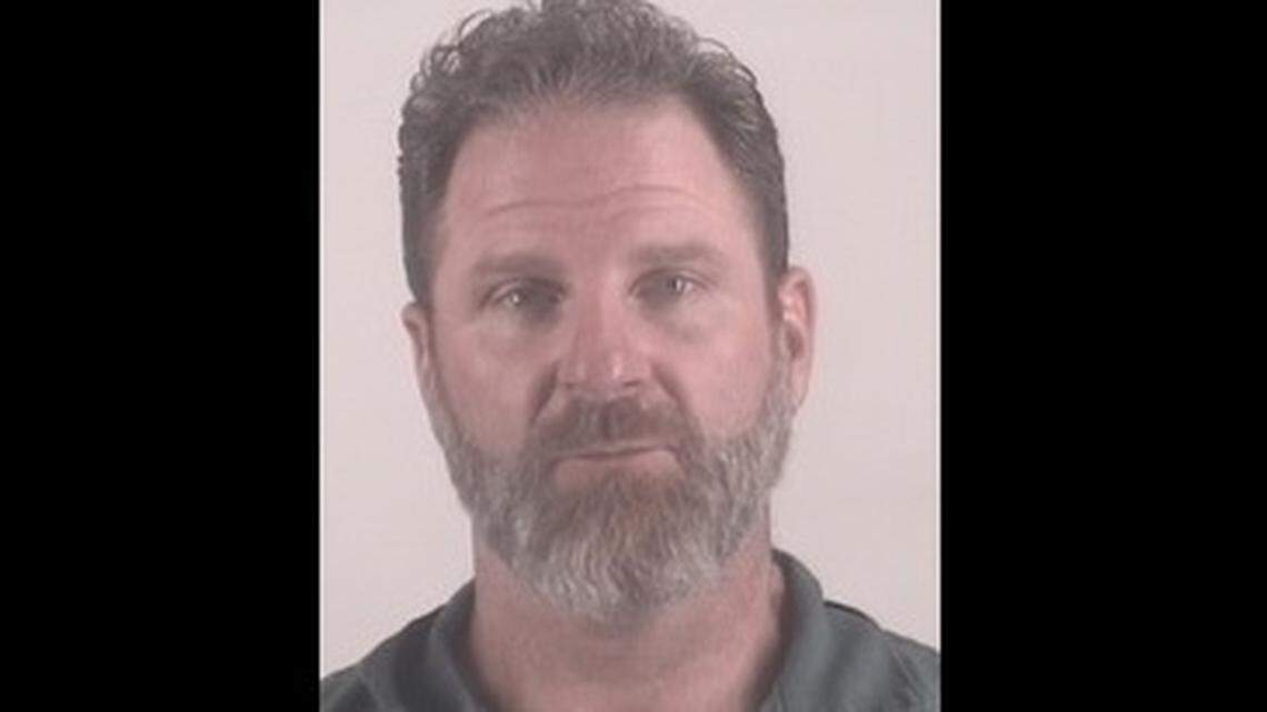 Aaron Redmond of Mansfield, accused of assaulting his wife, held police at bay for four hours from his home Friday night before he surrendered to authorities.