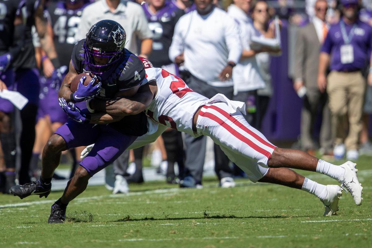 OU safety Justin Broiles tackles TCU wide receiver Taye Barber at the Amon G. Carter Stadium in Fort Worth, Texas, on Saturday, Oct. 1, 2022.